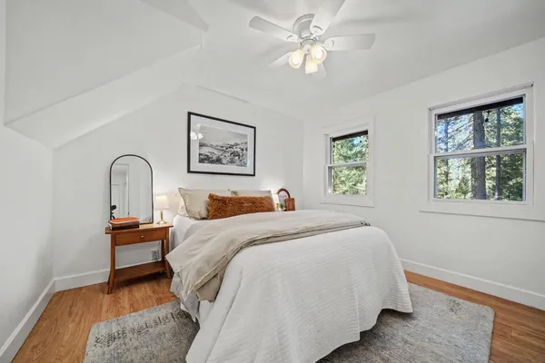 a view of an empty room and wooden floor