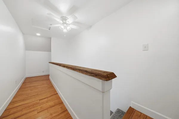 a view of a house with a yard next to a yard