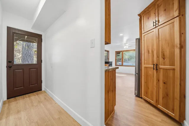 a view of work space with wooden floor and furniture