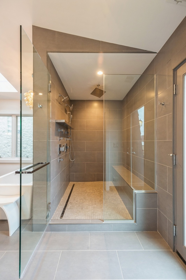 1643 West Julian Street Chicago, IL 60622 - Photo 14 of 20 a bathroom with a shower and a glass door