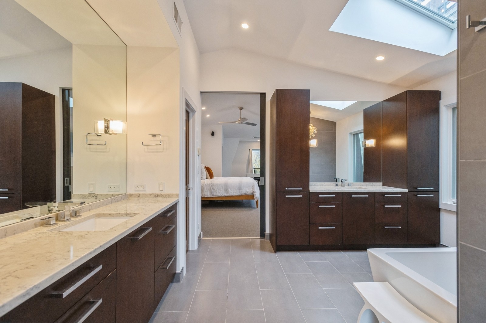 1643 West Julian Street Chicago, IL 60622 - Photo 16 of 20 a spacious bathroom with a granite countertop double vanity and a bathtub
