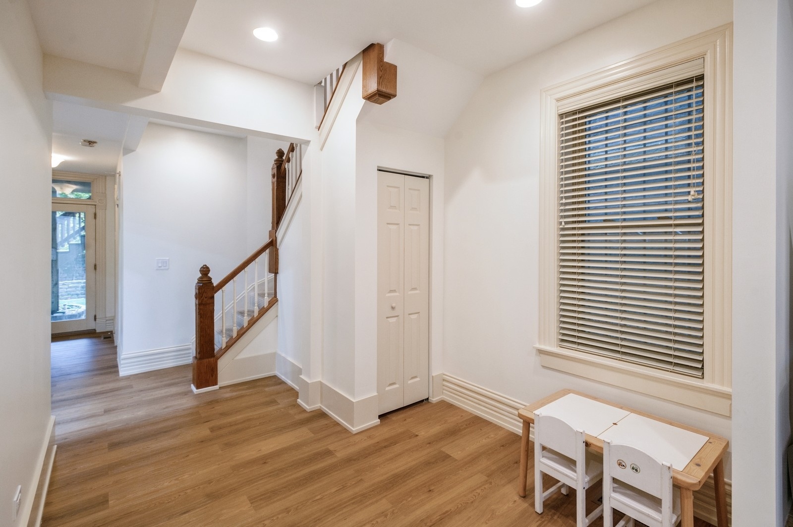 1643 West Julian Street Chicago, IL 60622 - Photo 9 of 20 a view of a hallway with wooden floor and stairs
