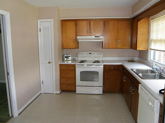 2239 Ranch Road Northwest Roanoke, VA 24017 - Photo 4 of 15 a kitchen with a stove top oven sink and cabinets