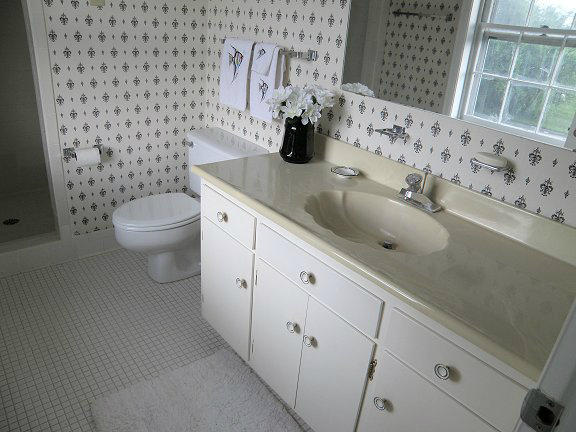 2239 Ranch Road Northwest Roanoke, VA 24017 - Photo 7 of 15 a bathroom with a granite countertop toilet sink and mirror