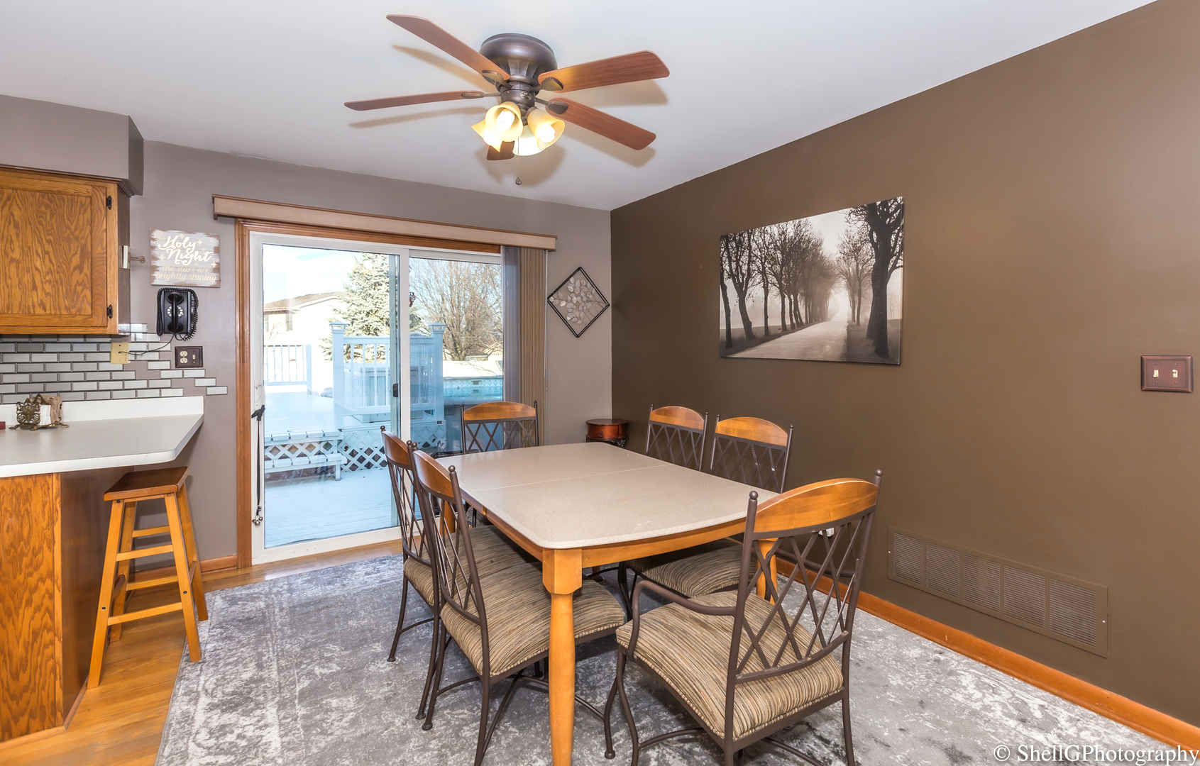 707 Amber Road New Lenox, IL 60451 - Photo 8 of 24 a view of a dining room with furniture window and outside view