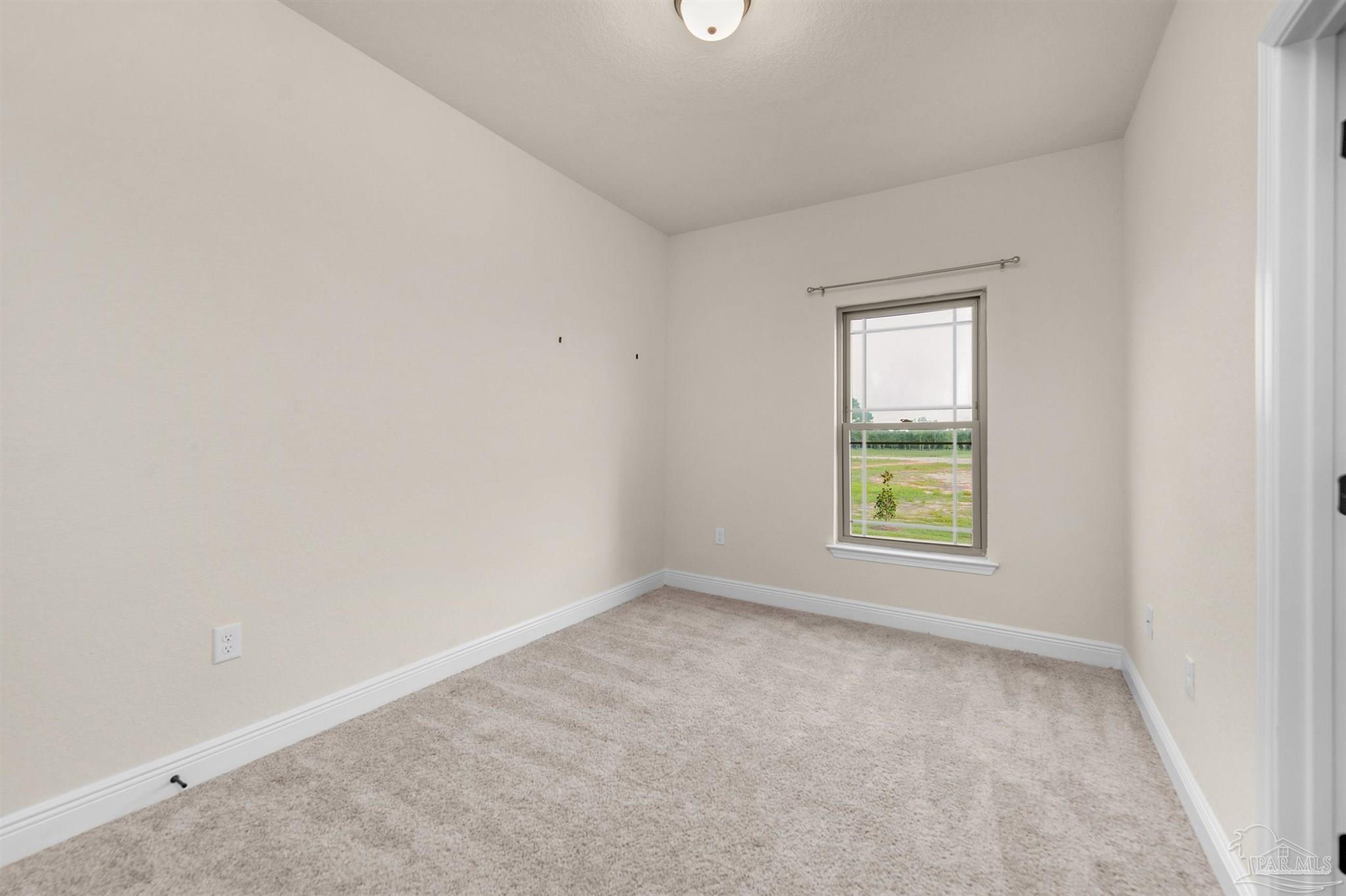 5069 Peach Drive Pace, FL 32571 - Photo 23 of 41 an empty room with windows