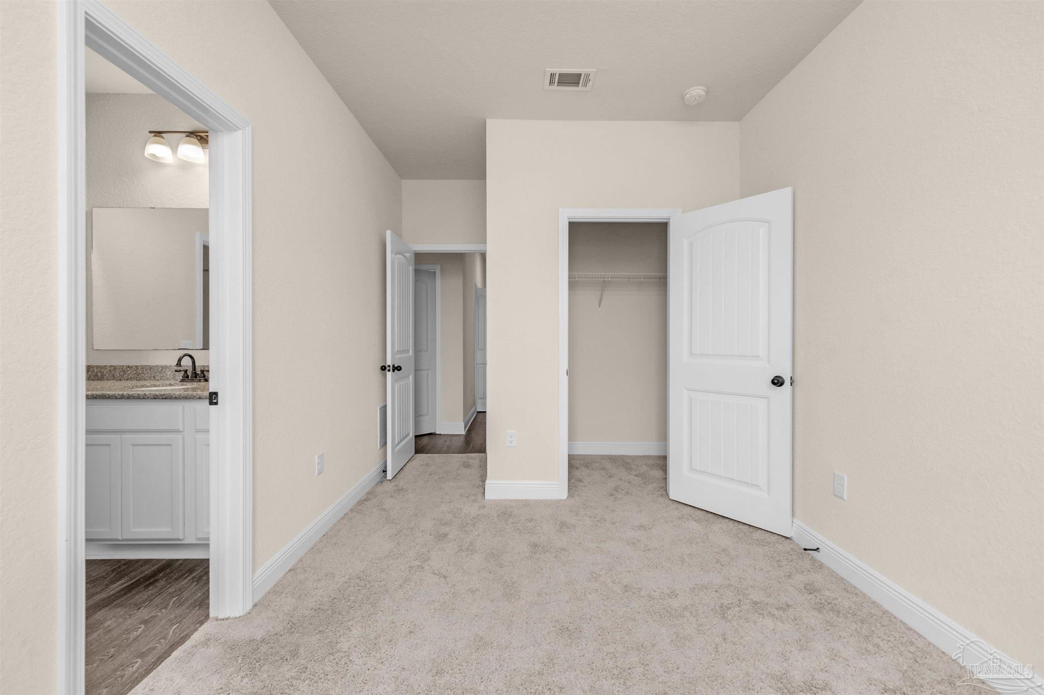 5069 Peach Drive Pace, FL 32571 - Photo 25 of 41 a view of a hallway with closet and entryway