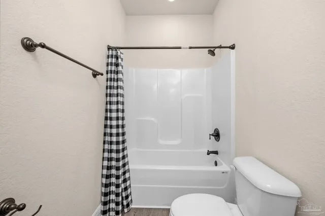 a bathroom with a toilet a sink and a bathtub