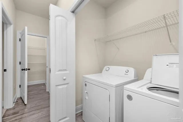 a view of storage and utility room with washer and dryer