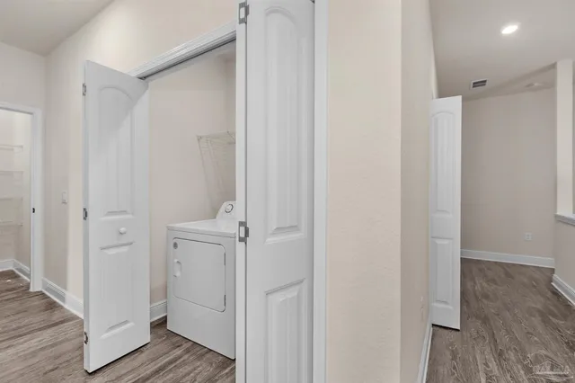 a view of bathroom with wooden floor