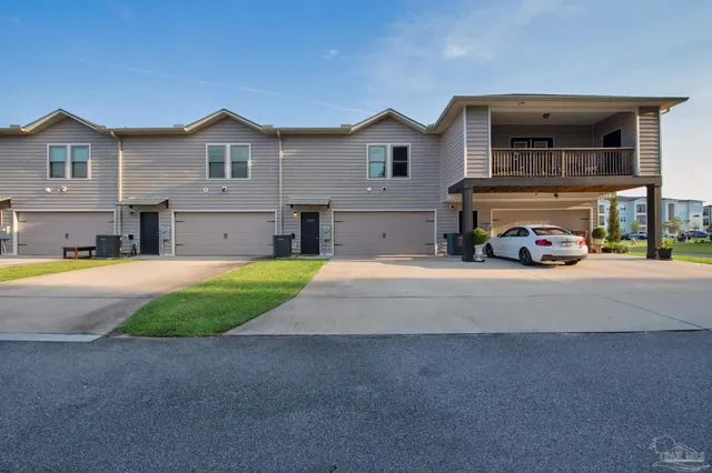 a view of house with outdoor space and view of house
