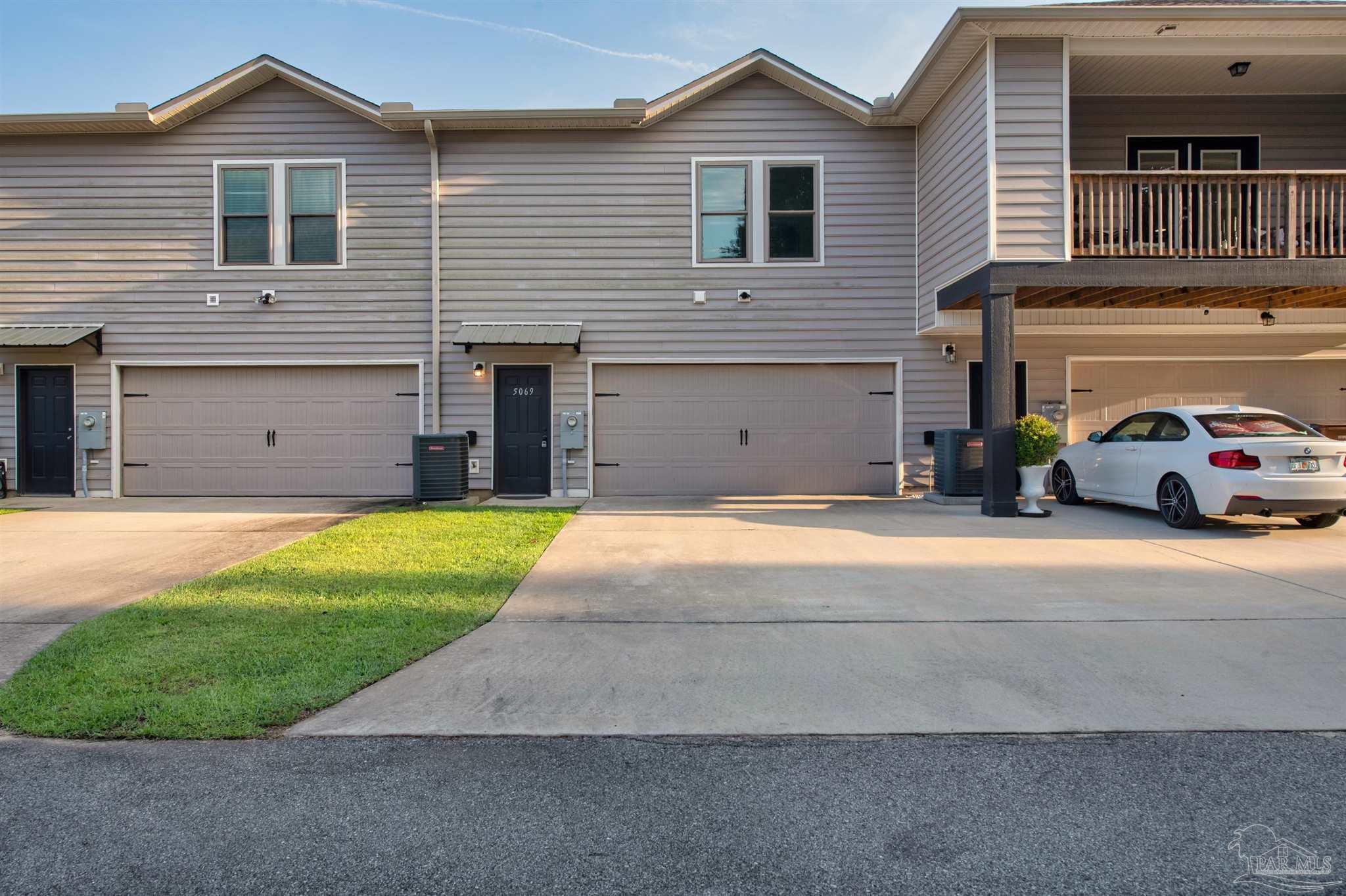 5069 Peach Drive Pace, FL 32571 - Photo 37 of 41 a house view with a garden space