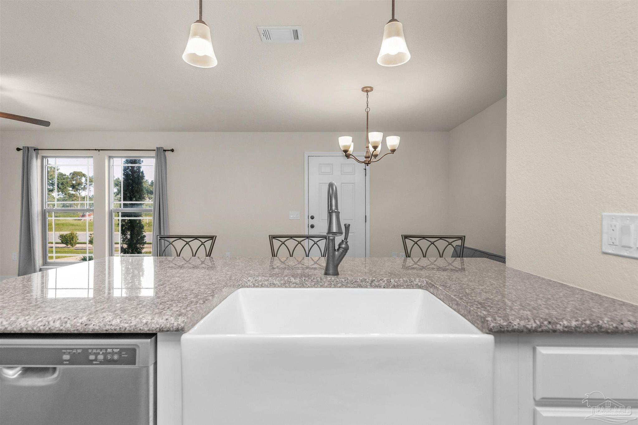 5069 Peach Drive Pace, FL 32571 - Photo 10 of 41 a spacious bathroom with a granite countertop sink a mirror and shower
