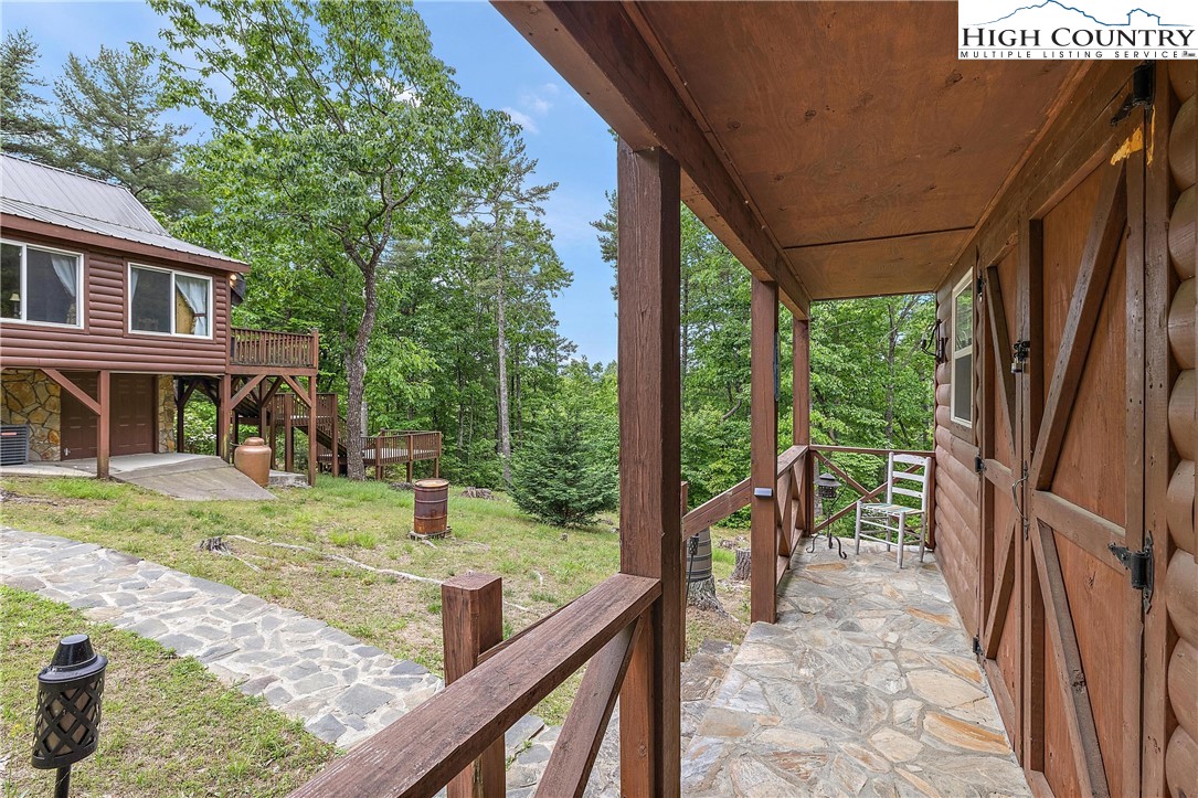1158 Staghorn Road Purlear, NC 28665 - Photo 24 of 48 a view of house with backyard porch and furniture
