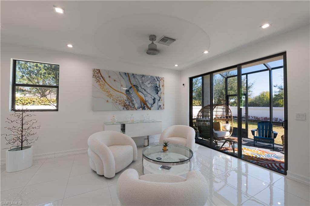 7510 Rockefeller Drive Naples, FL 34119 - Photo 12 of 31 Living area with tile patterned floors and recessed lighting