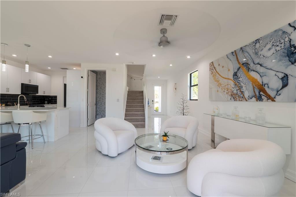 7510 Rockefeller Drive Naples, FL 34119 - Photo 15 of 31 Living area featuring light tile patterned floors, ceiling fan, and recessed lighting