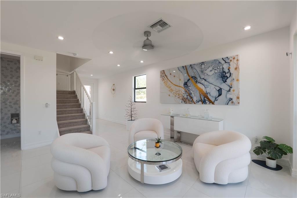 7510 Rockefeller Drive Naples, FL 34119 - Photo 16 of 31 Sitting room featuring ceiling fan, light tile patterned floors, and recessed lighting