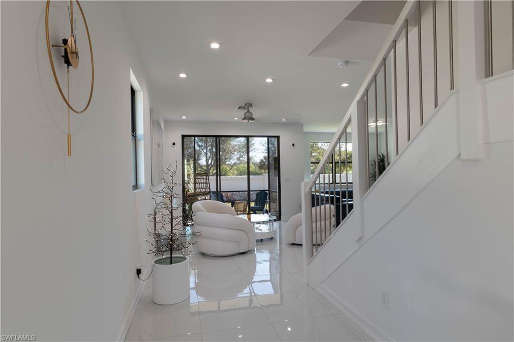 7510 Rockefeller Drive Naples, FL 34119 - Photo 20 of 31 Living room with baseboards and recessed lighting