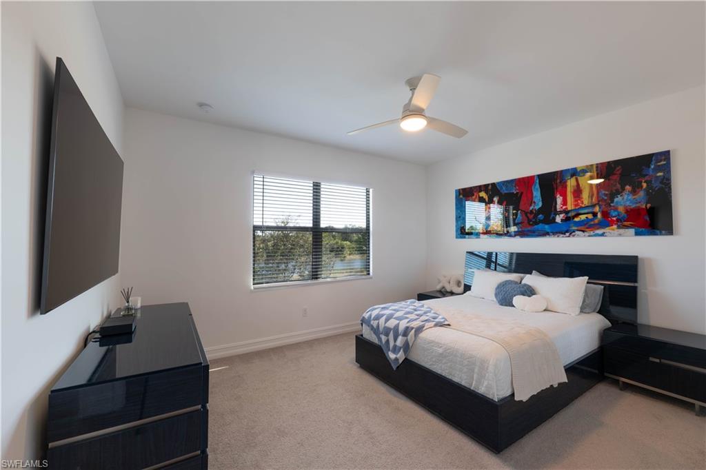 7510 Rockefeller Drive Naples, FL 34119 - Photo 23 of 31 Bedroom with light carpet and ceiling fan