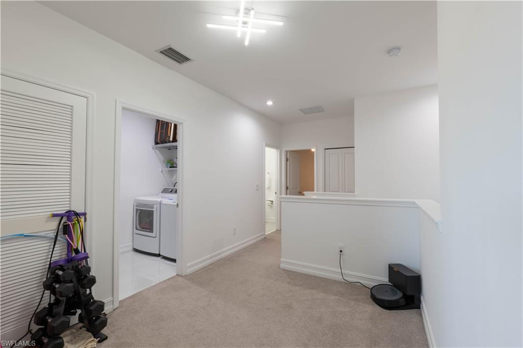 7510 Rockefeller Drive Naples, FL 34119 - Photo 26 of 31 Spare room with light carpet, washing machine and clothes dryer, and recessed lighting