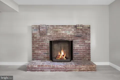 a stone house with fireplace