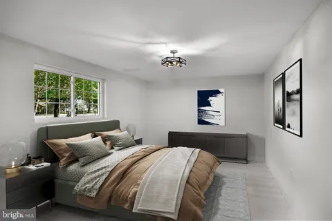 a bedroom with bed and window