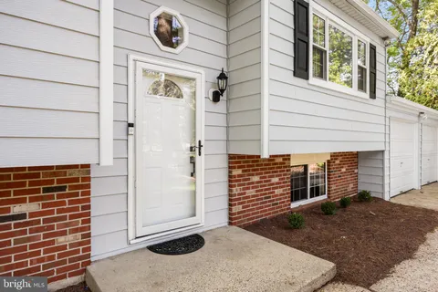 a front view of a house with garage