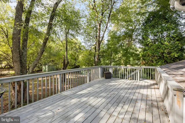 a balcony with view of trees in front of it