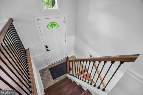 a view of a balcony with wooden floor