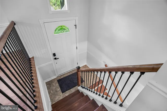 a view of a balcony with wooden floor
