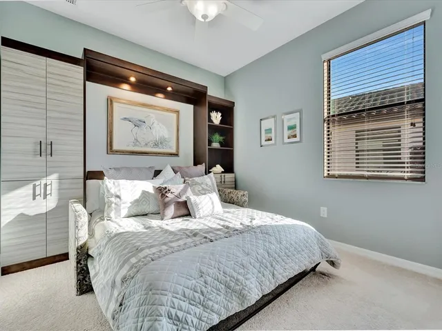 an aerial view of residential houses with outdoor space and river