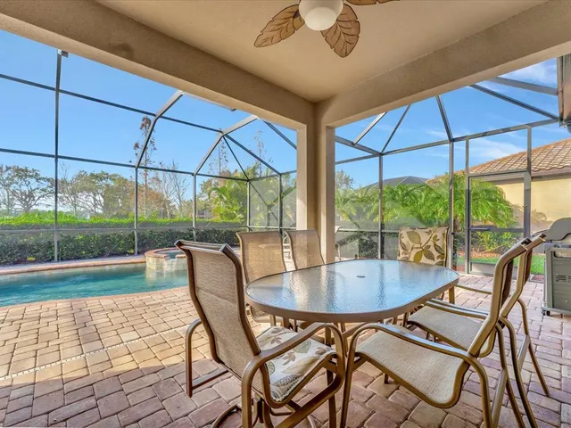 a view of a swimming pool with a patio