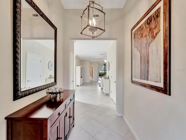 a kitchen with a stove and a chair