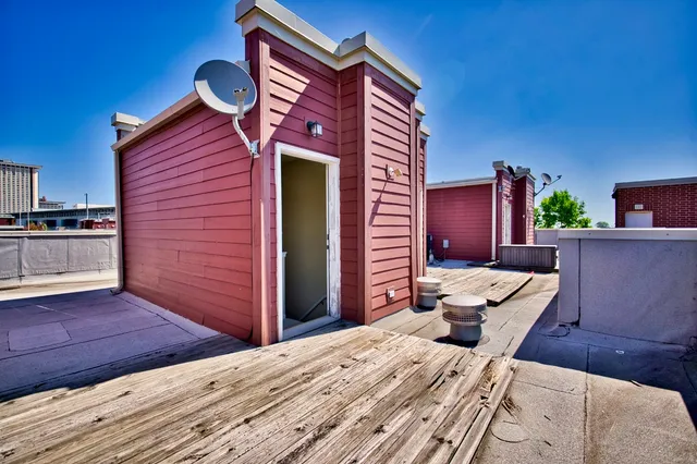 a bed room with a bed and a television