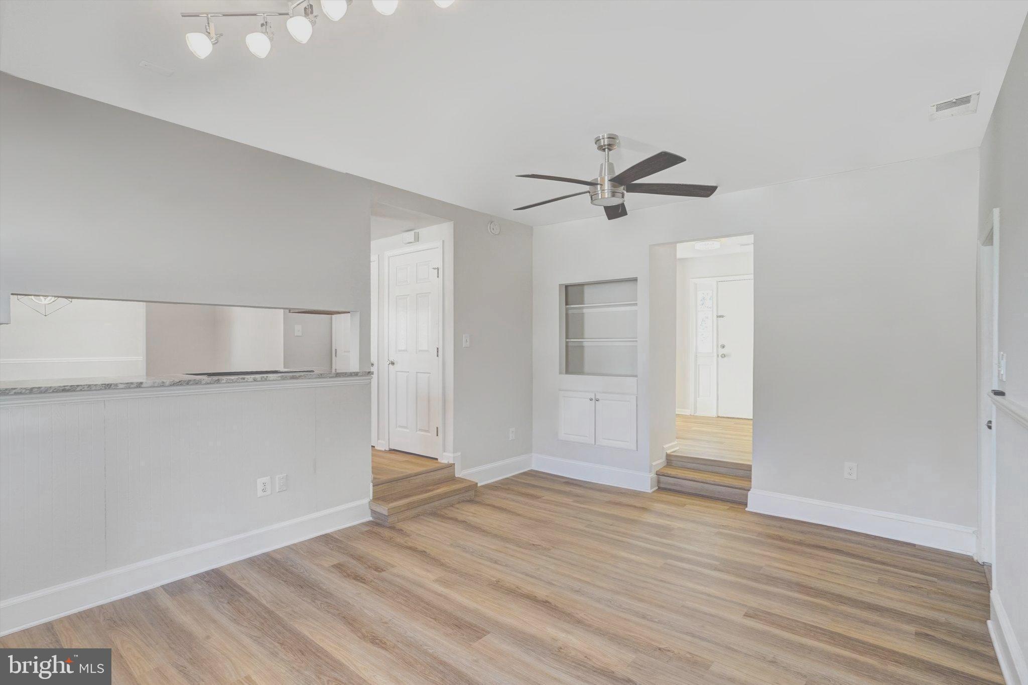 1324 Rock Chapel Road Herndon, VA 20170 - Photo 16 of 42 an empty room with wooden floor and ceiling fan