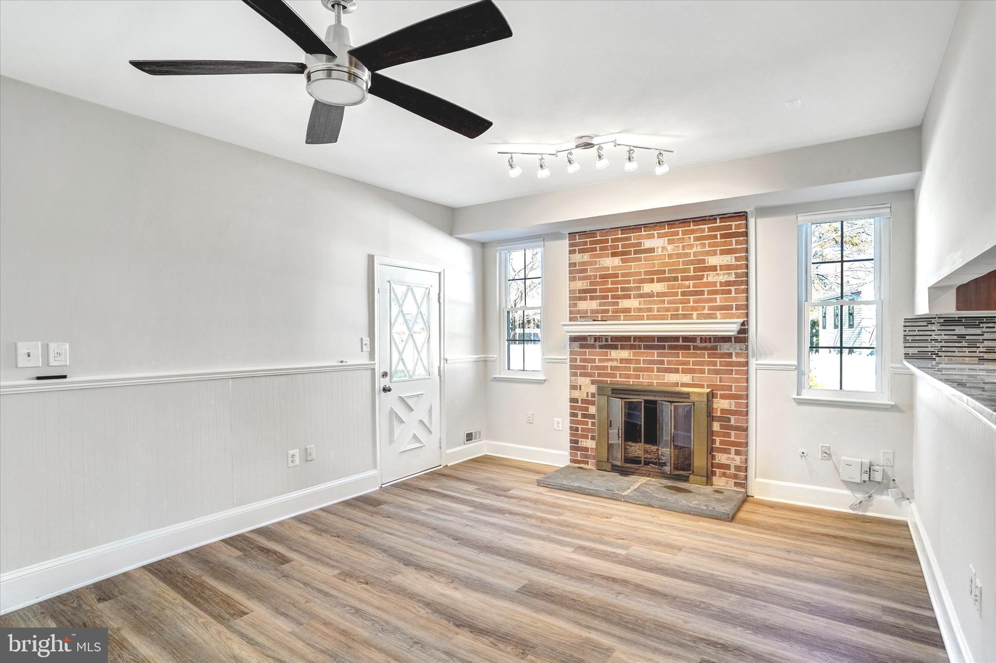 1324 Rock Chapel Road Herndon, VA 20170 - Photo 17 of 42 a view of empty room with wooden floor and fireplace