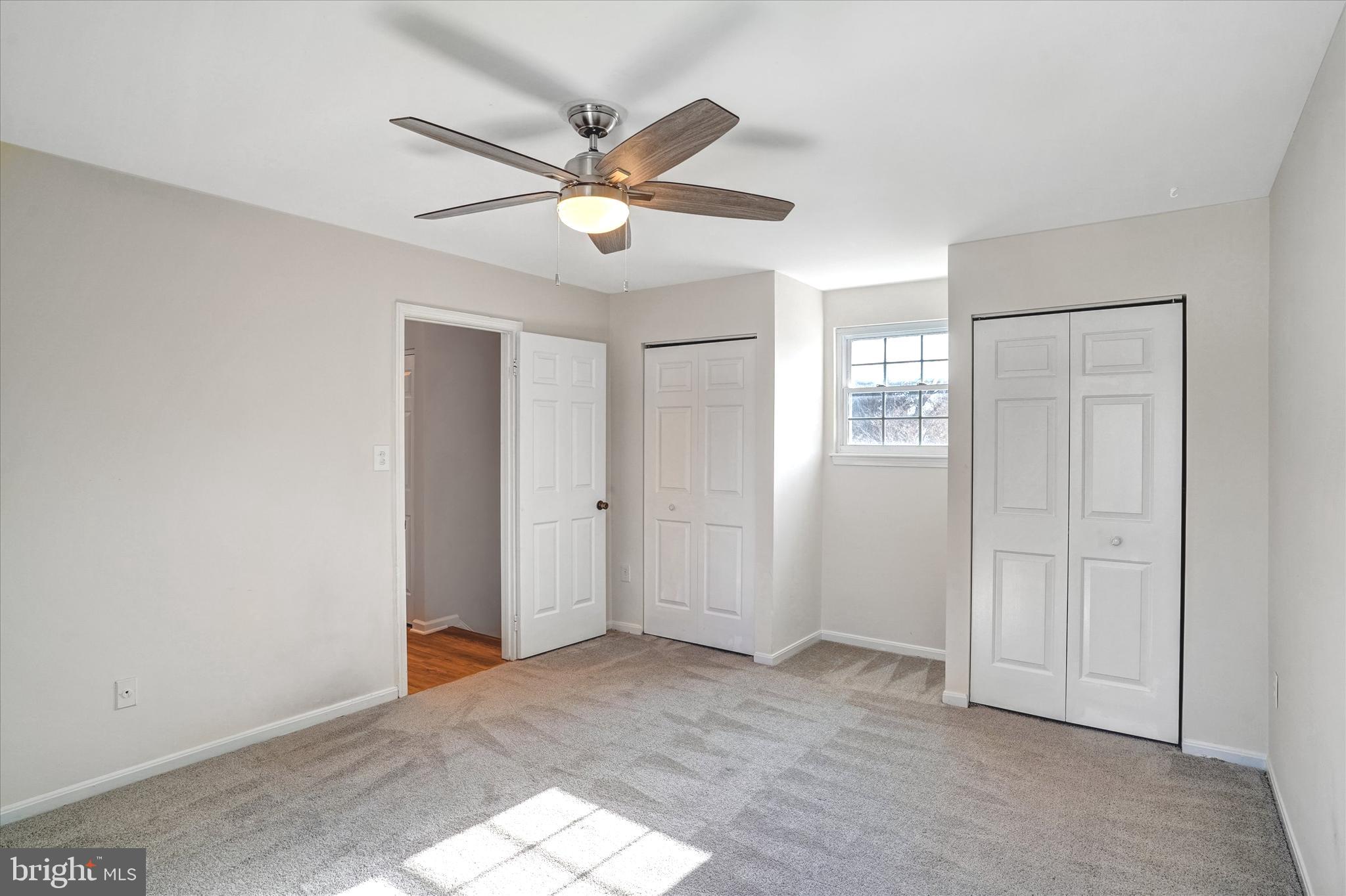 1324 Rock Chapel Road Herndon, VA 20170 - Photo 25 of 42 a view of an empty room with a fan