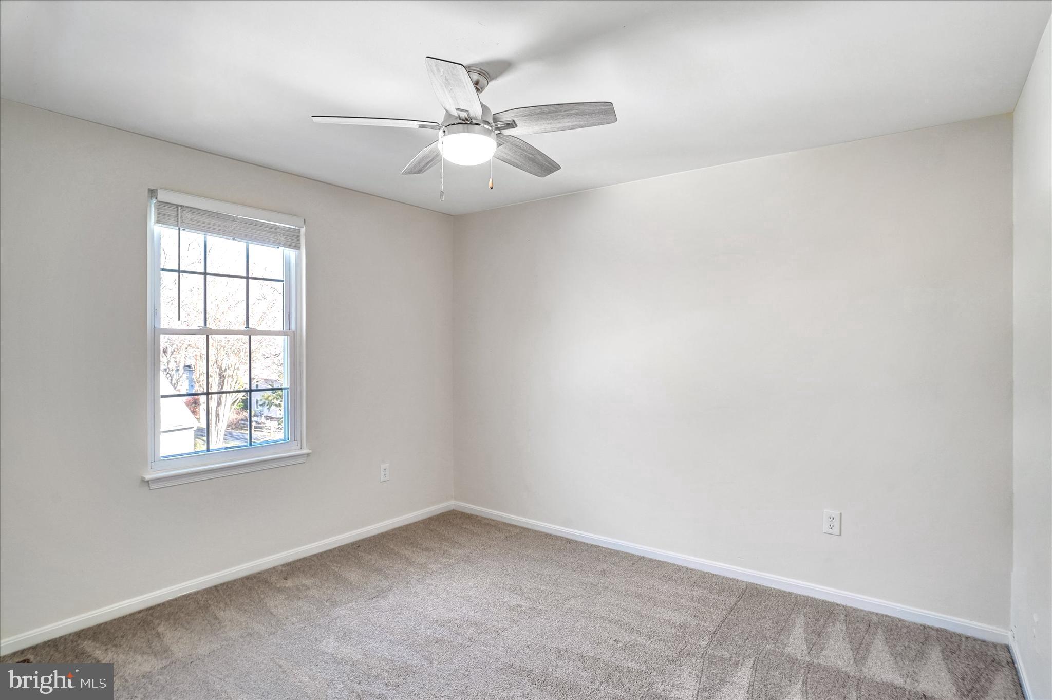1324 Rock Chapel Road Herndon, VA 20170 - Photo 26 of 42 an empty room with windows and fan