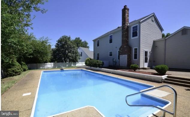 1324 Rock Chapel Road Herndon, VA 20170 - Photo 35 of 42 a view of a house with swimming pool and sitting area