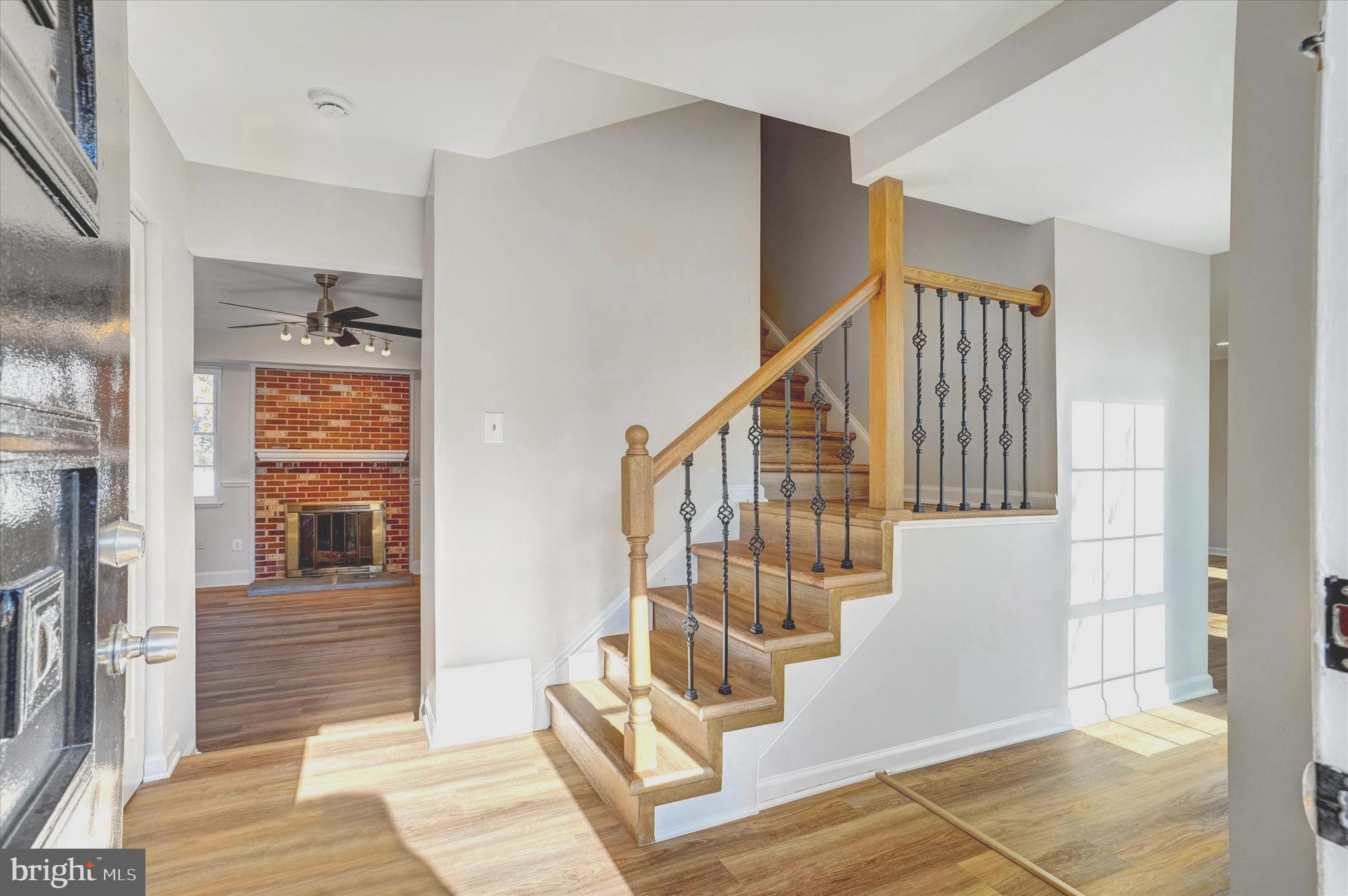 1324 Rock Chapel Road Herndon, VA 20170 - Photo 4 of 42 a view of an entryway with wooden floor and door
