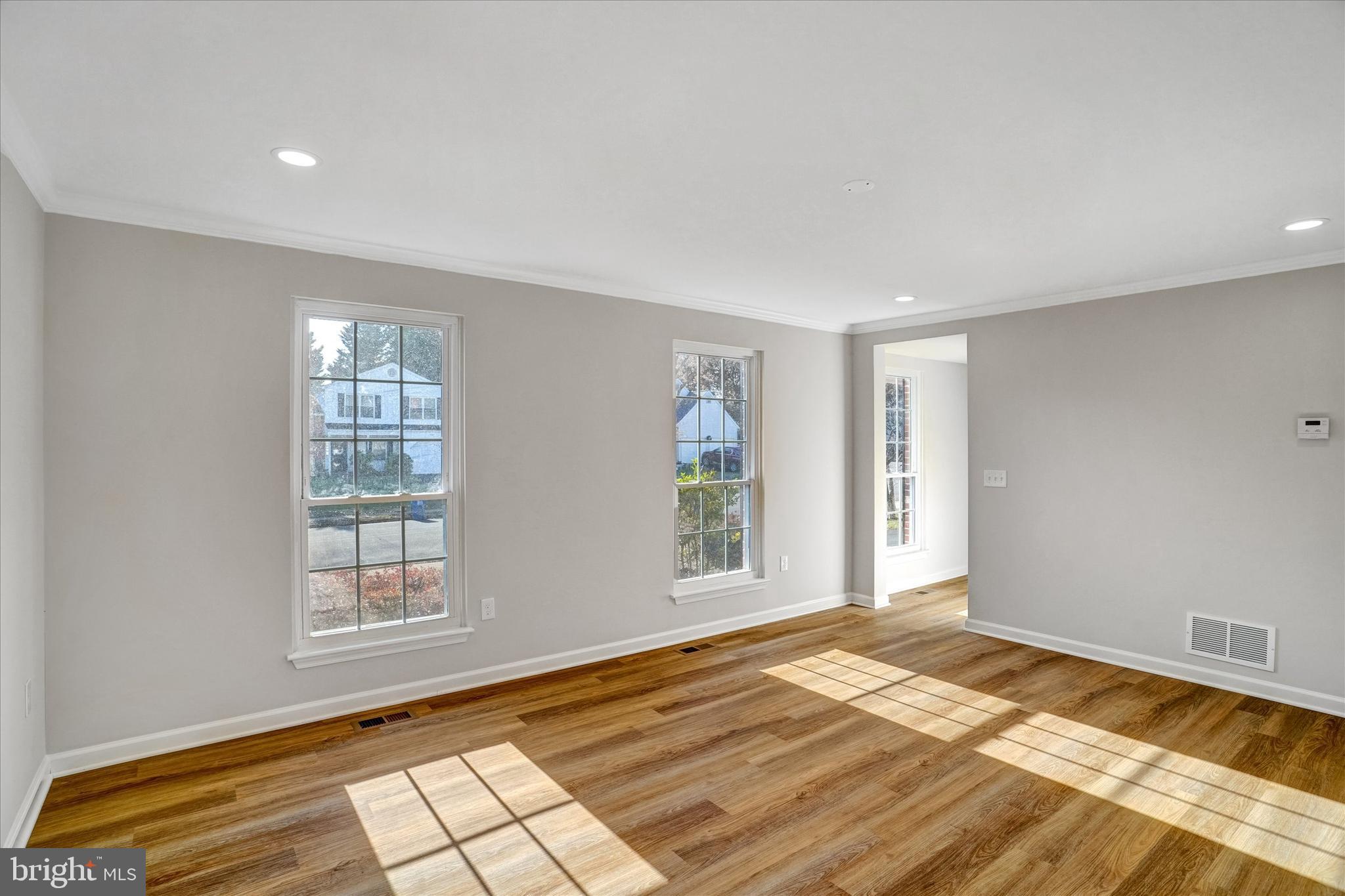 1324 Rock Chapel Road Herndon, VA 20170 - Photo 5 of 42 a view of empty room with window and wooden floor