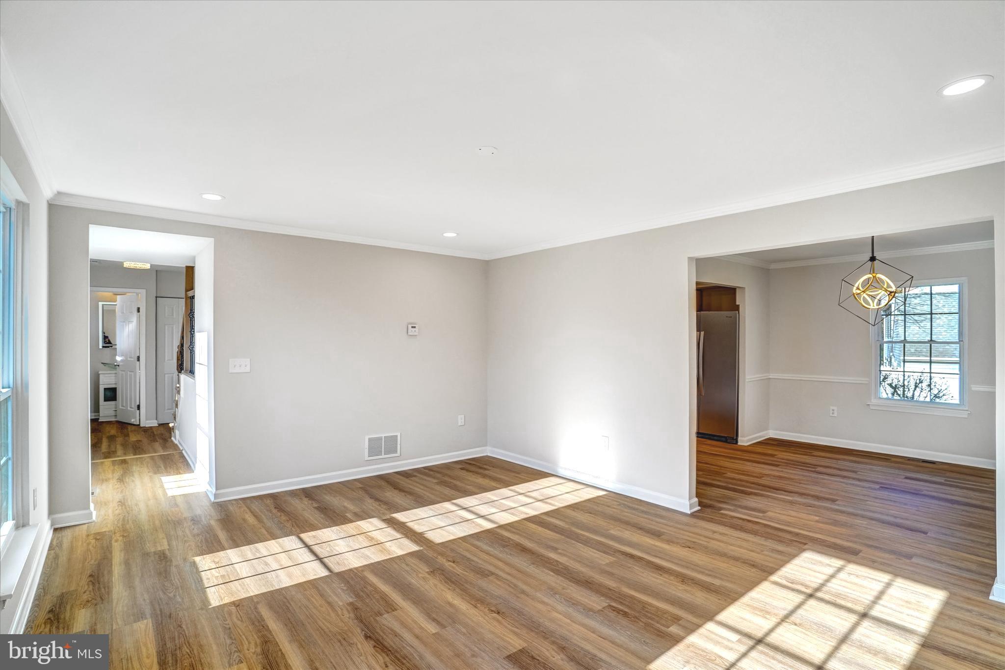 1324 Rock Chapel Road Herndon, VA 20170 - Photo 7 of 42 a view of empty room with wooden floor and fan
