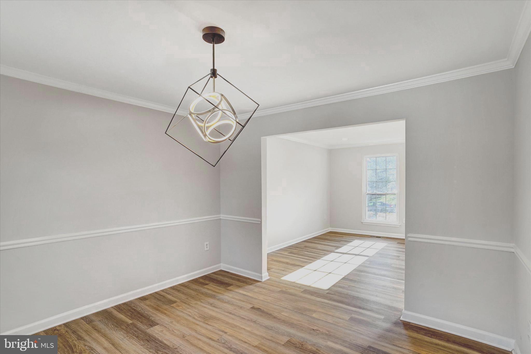 1324 Rock Chapel Road Herndon, VA 20170 - Photo 9 of 42 a view of empty room with wooden floor and fan