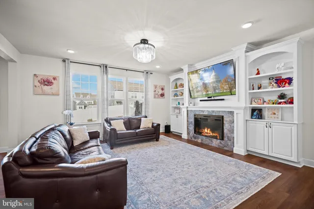 a living room with furniture or flat screen tv and a fireplace