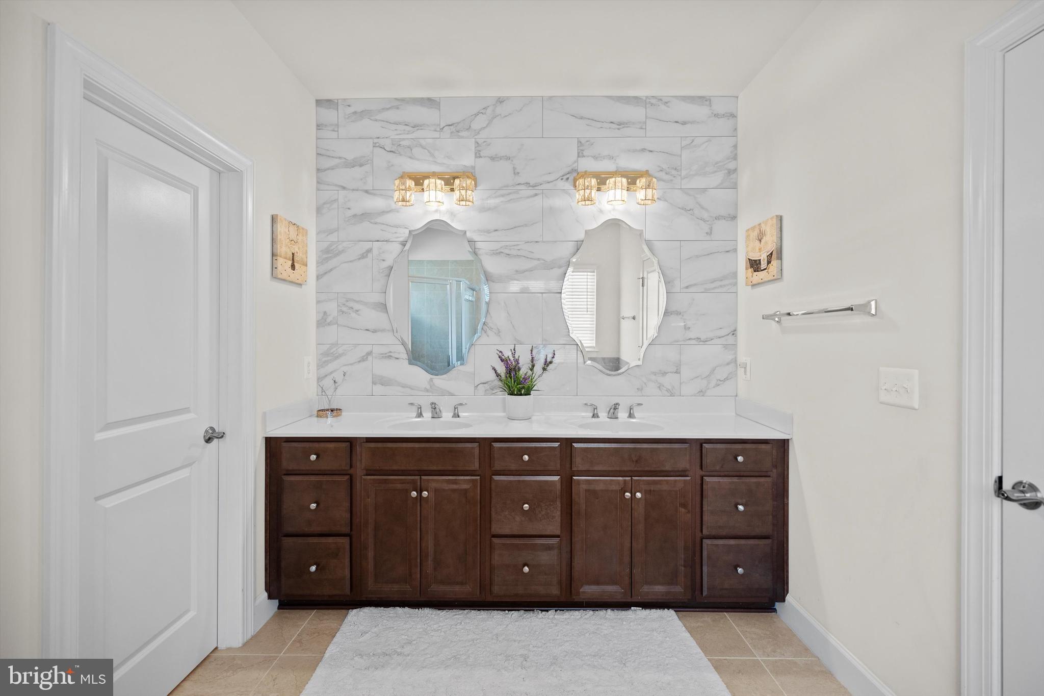 8690 Belle Grove Way Manassas, VA 20110 - Photo 22 of 55 a bathroom with a granite countertop sink and a mirror