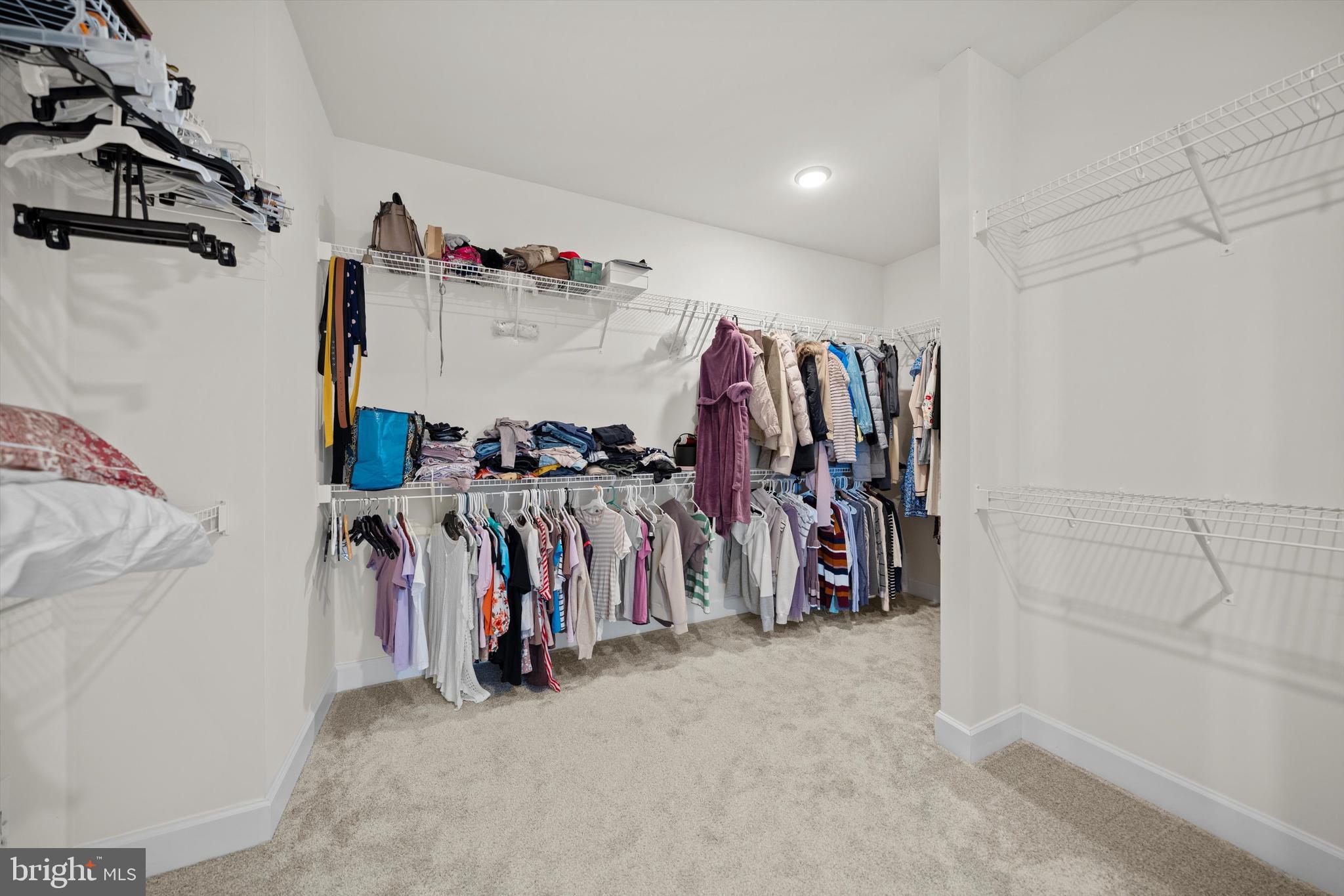 8690 Belle Grove Way Manassas, VA 20110 - Photo 23 of 55 a view of walk in closet with clothes