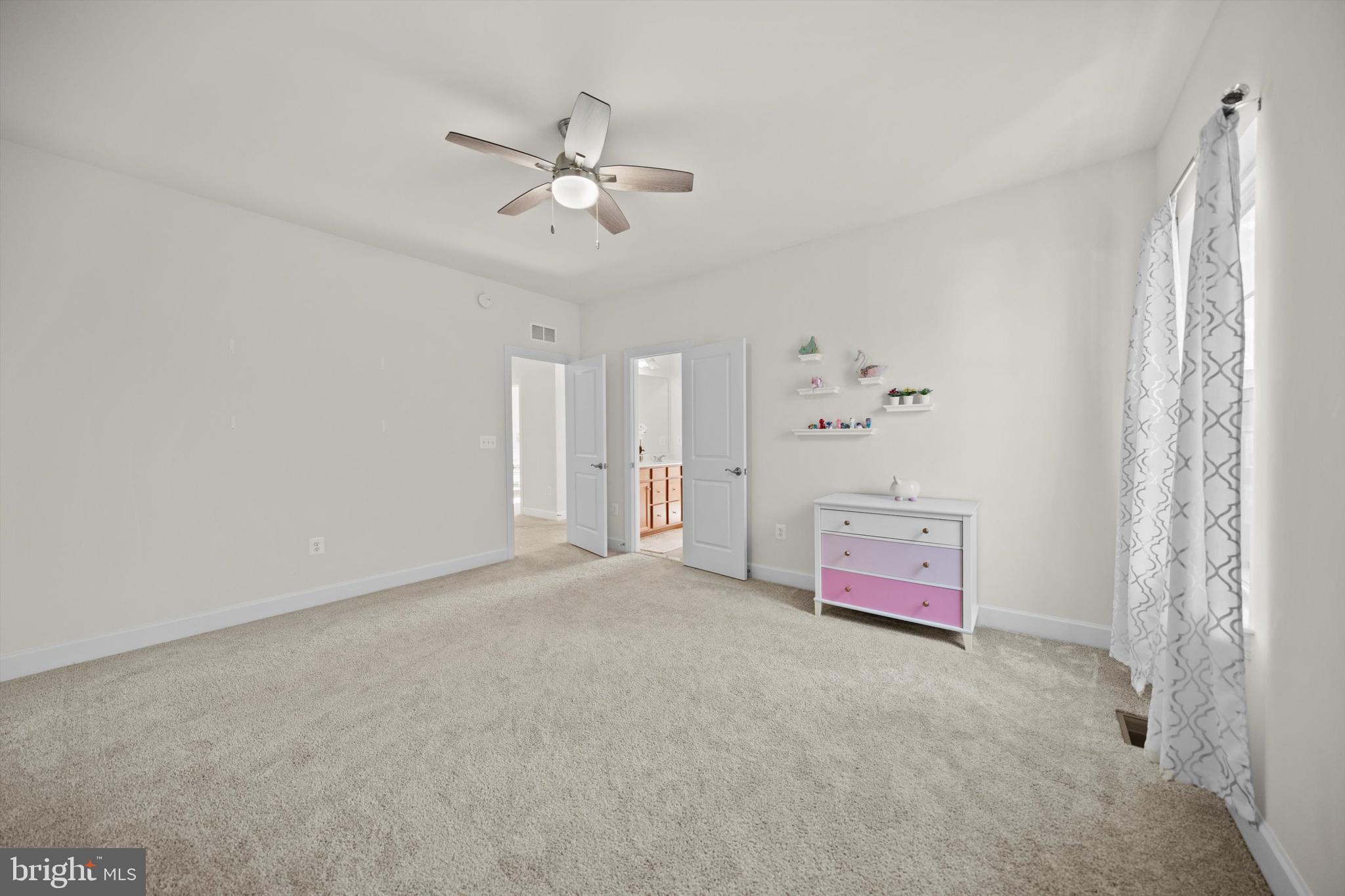 8690 Belle Grove Way Manassas, VA 20110 - Photo 25 of 55 a view of an empty room with chandelier fan