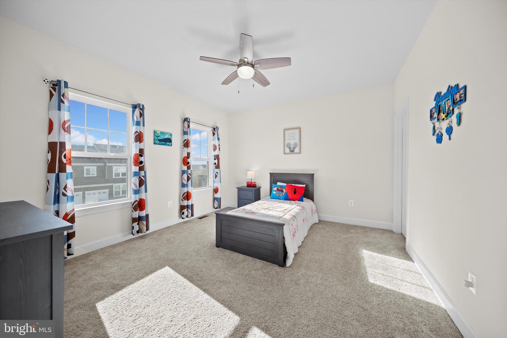 8690 Belle Grove Way Manassas, VA 20110 - Photo 28 of 55 a living room with a couch and dresser