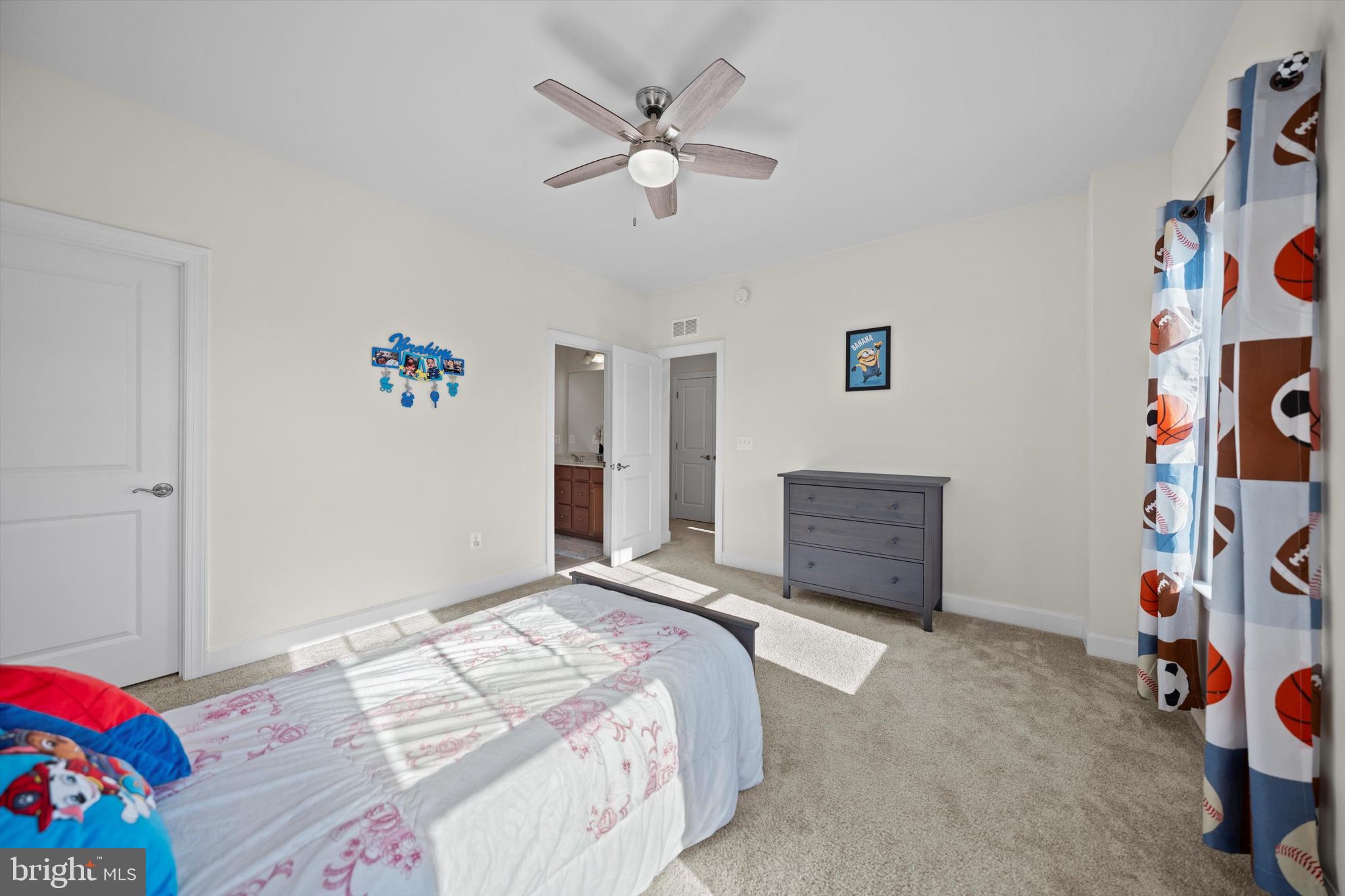 8690 Belle Grove Way Manassas, VA 20110 - Photo 30 of 55 a bedroom with a bed and a window