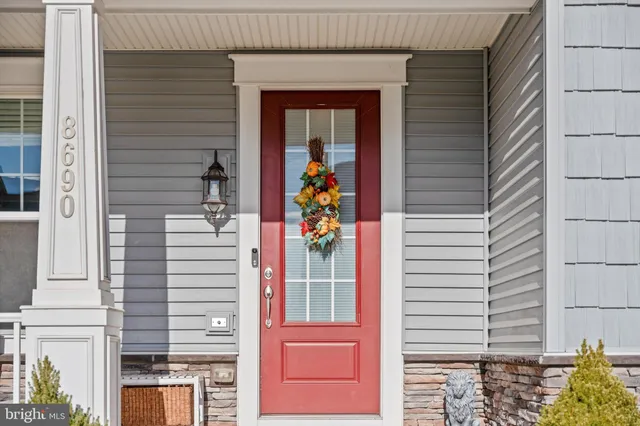 a view of a door and a window